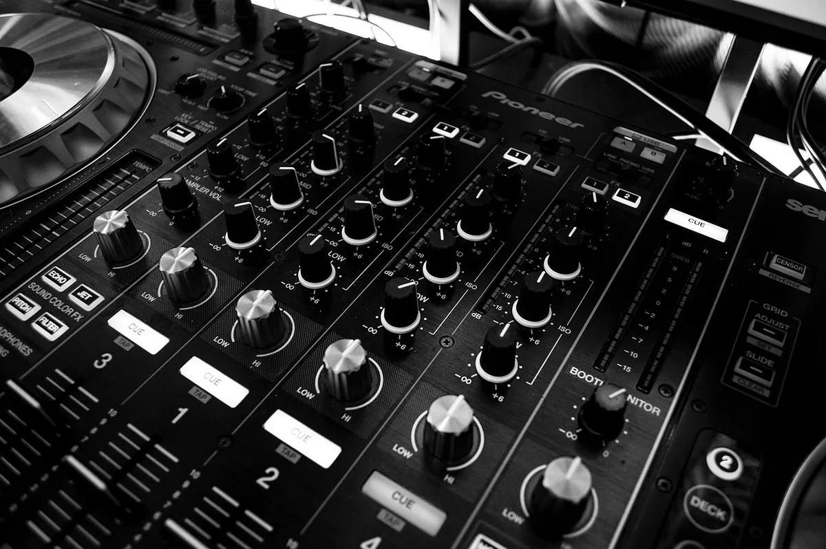 A close-up of a computer screen showing an audio waveform and EQ settings in a video editing software.